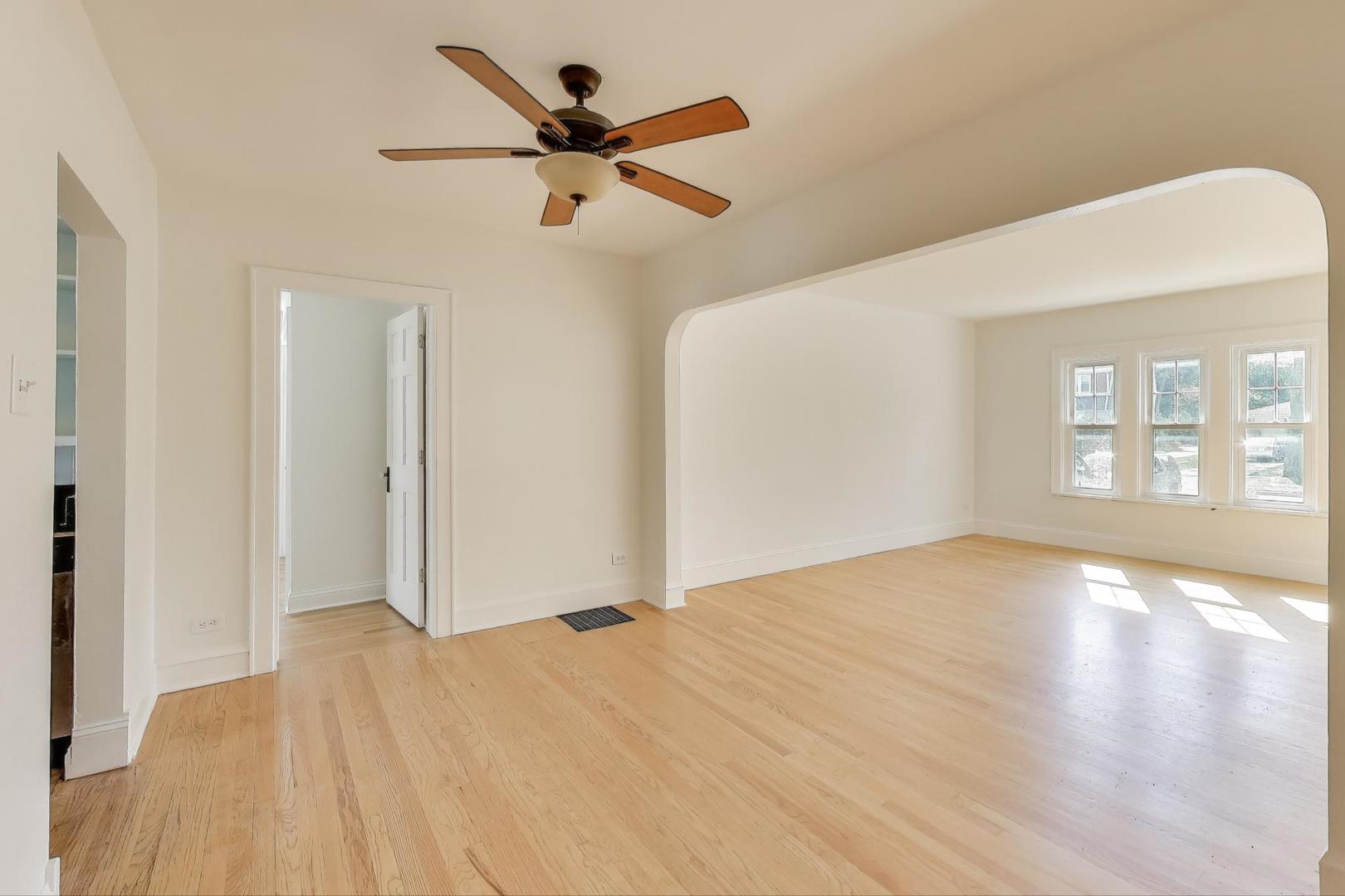 421 East Indiana Street Wheaton, IL 60187 - Photo 6 of 37 a view of empty room with wooden floor and fan