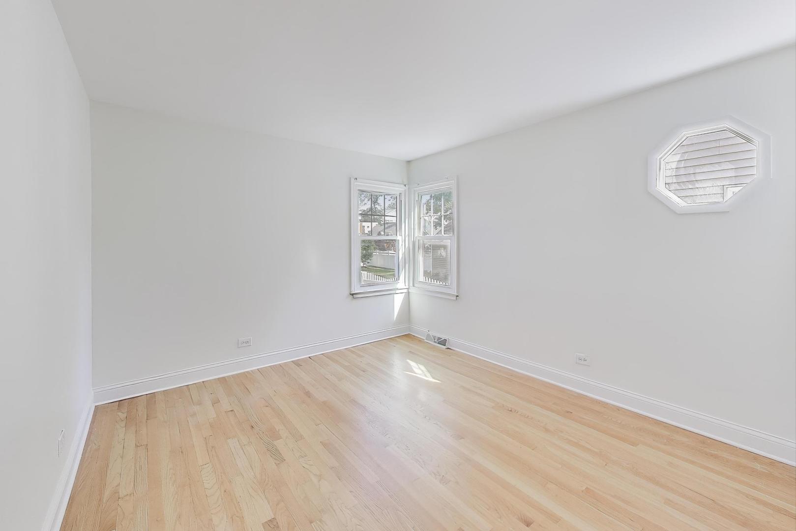 421 East Indiana Street Wheaton, IL 60187 - Photo 7 of 37 an empty room with windows