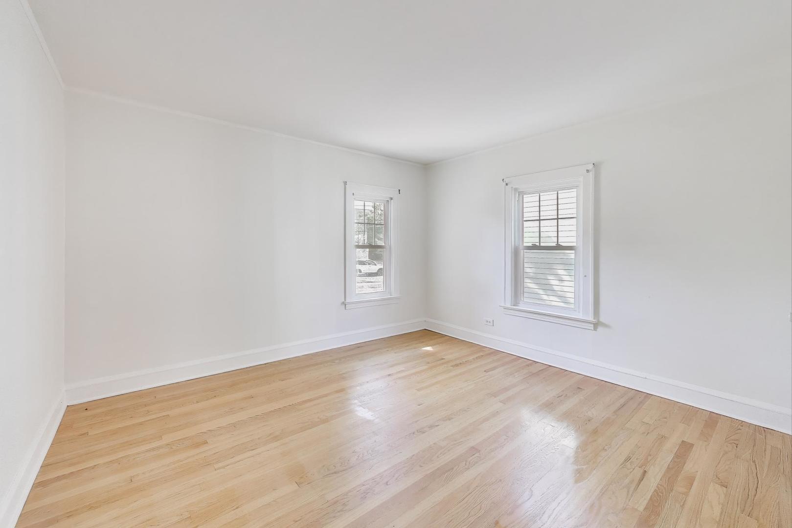 421 East Indiana Street Wheaton, IL 60187 - Photo 9 of 37 an empty room with windows