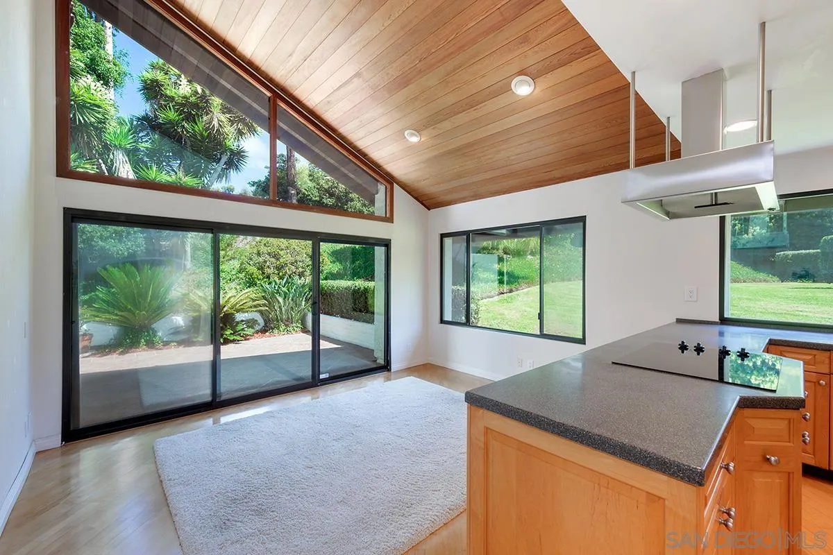 a kitchen that has a sink and a large window