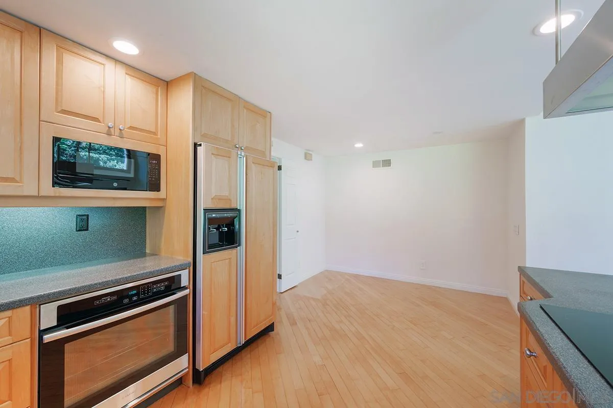 1332 Sun Valley Road Solana Beach, CA 92075 - Photo 13 of 38 a kitchen with a refrigerator stove and microwave