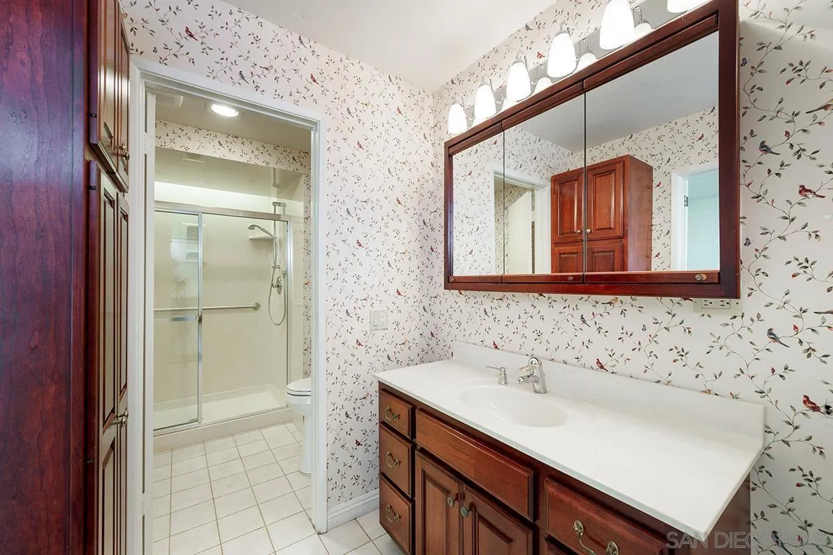 1332 Sun Valley Road Solana Beach, CA 92075 - Photo 26 of 38 a bathroom with a sink and a mirror