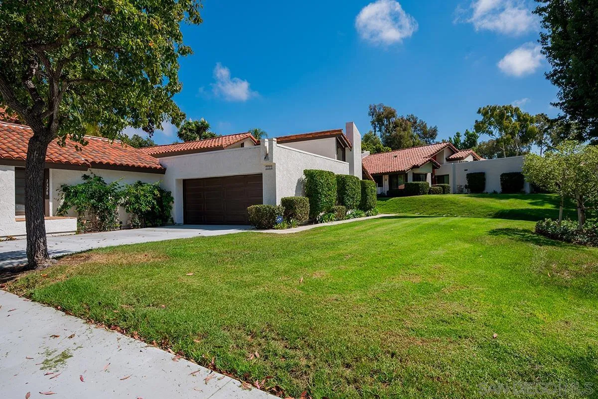 1332 Sun Valley Road Solana Beach, CA 92075 - Photo 33 of 38 a front view of a house with a yard and garage