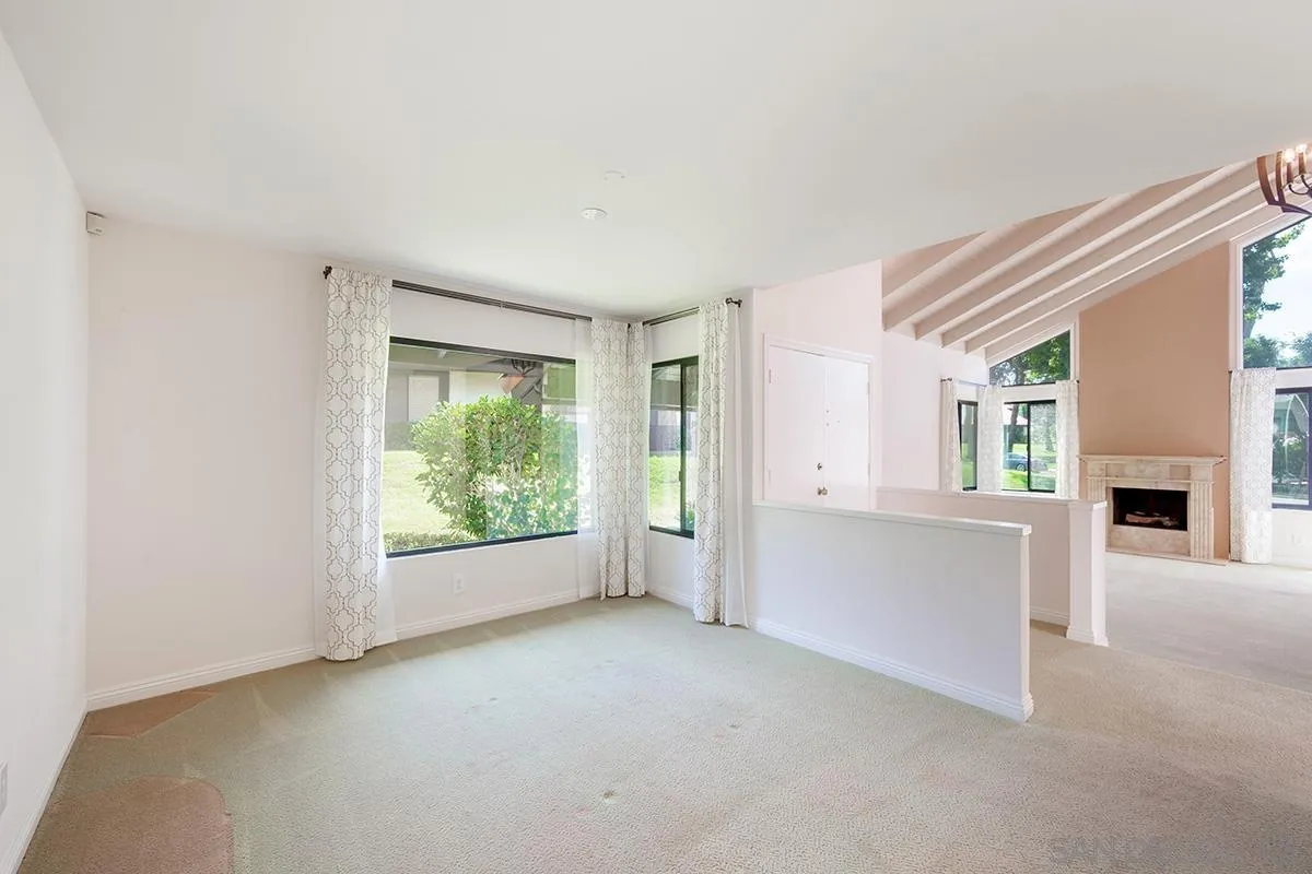 1332 Sun Valley Road Solana Beach, CA 92075 - Photo 8 of 38 a view of an empty room with a fireplace and a window
