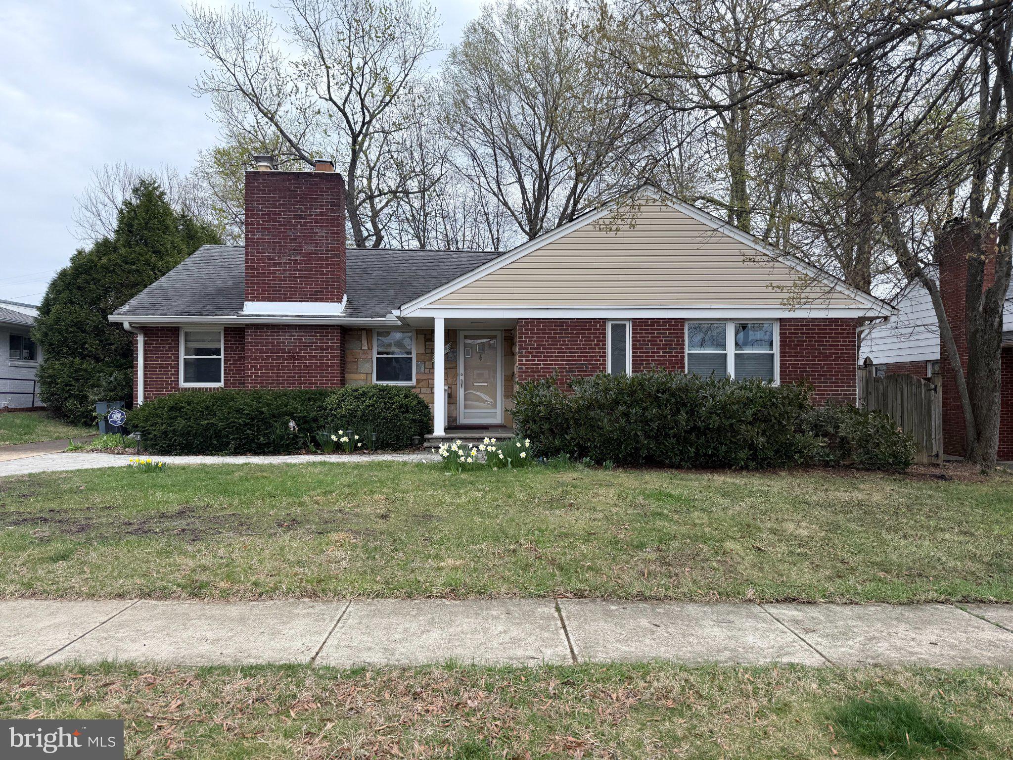 9709 Saxony Road Silver Spring, MD 20910 - Photo 2 of 47 a front view of a house with a yard