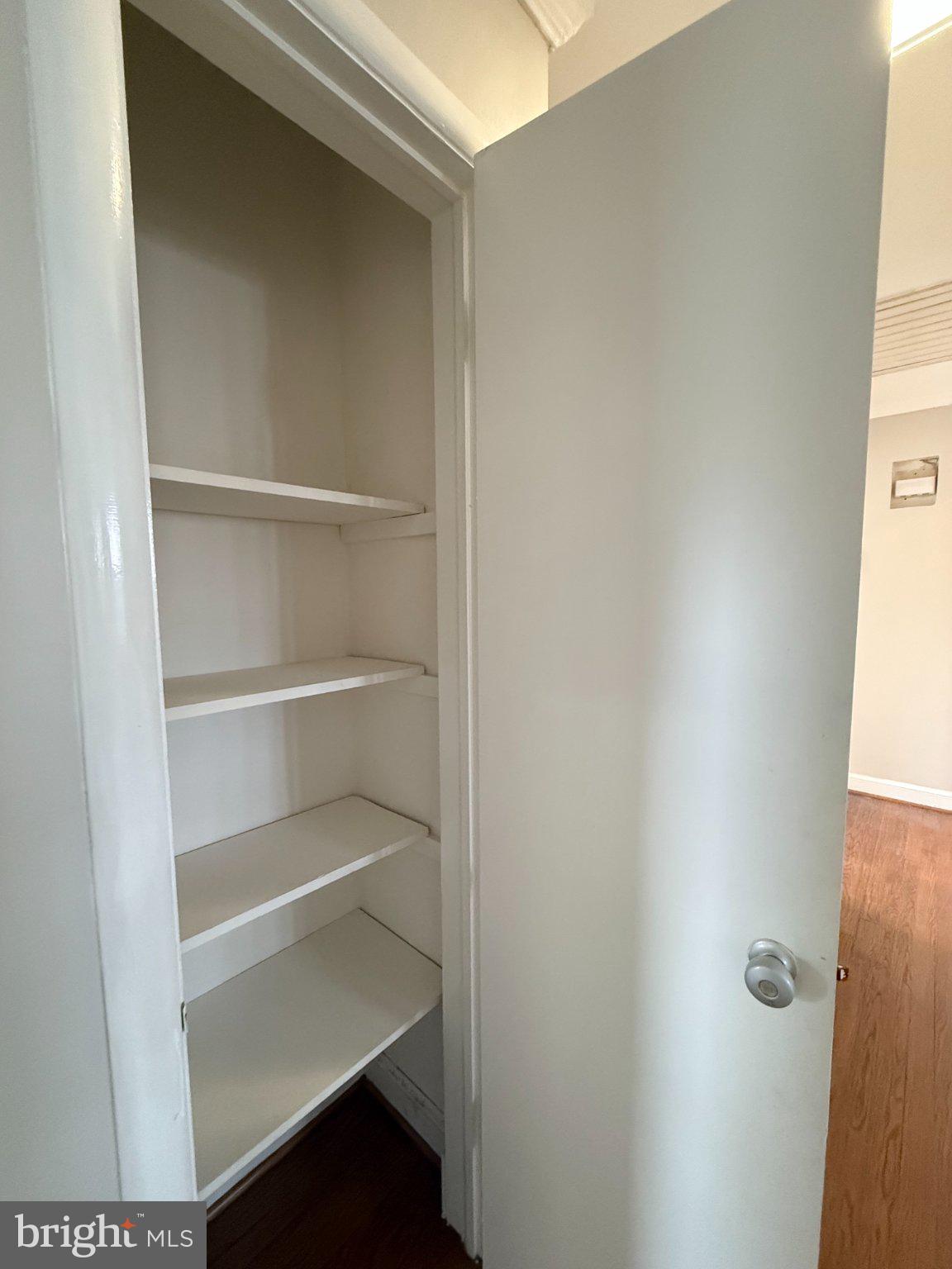 9709 Saxony Road Silver Spring, MD 20910 - Photo 21 of 47 a view of walk in closet with empty racks