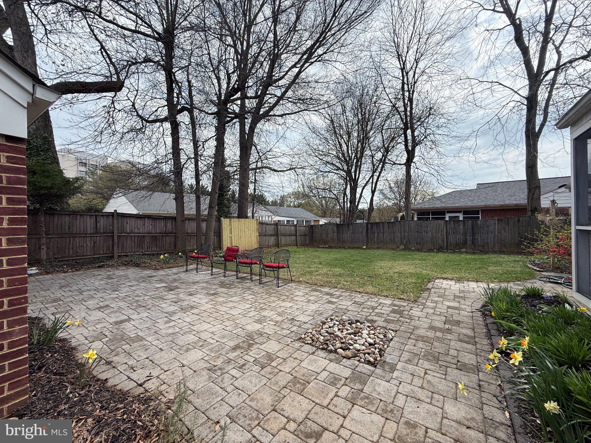 9709 Saxony Road Silver Spring, MD 20910 - Photo 5 of 47 a view of a yard with a tree and a bench