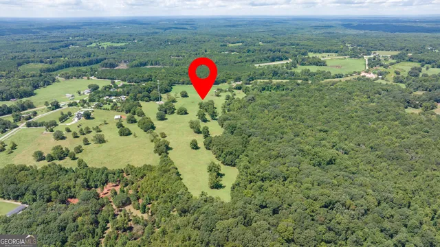an aerial view of houses with yard
