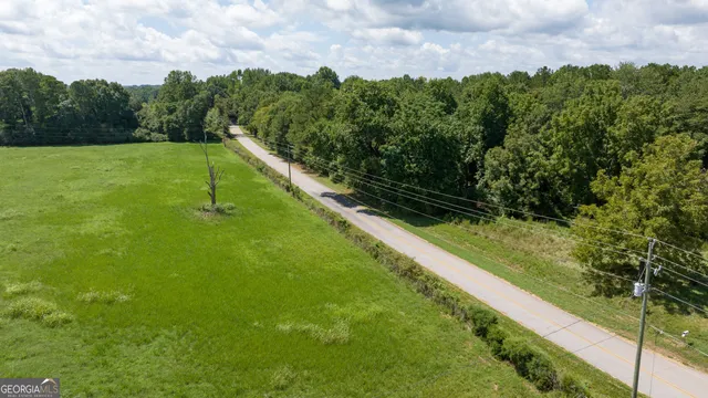 a view of a garden with a building in the background