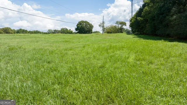 a backyard of a house with a yard and lake view