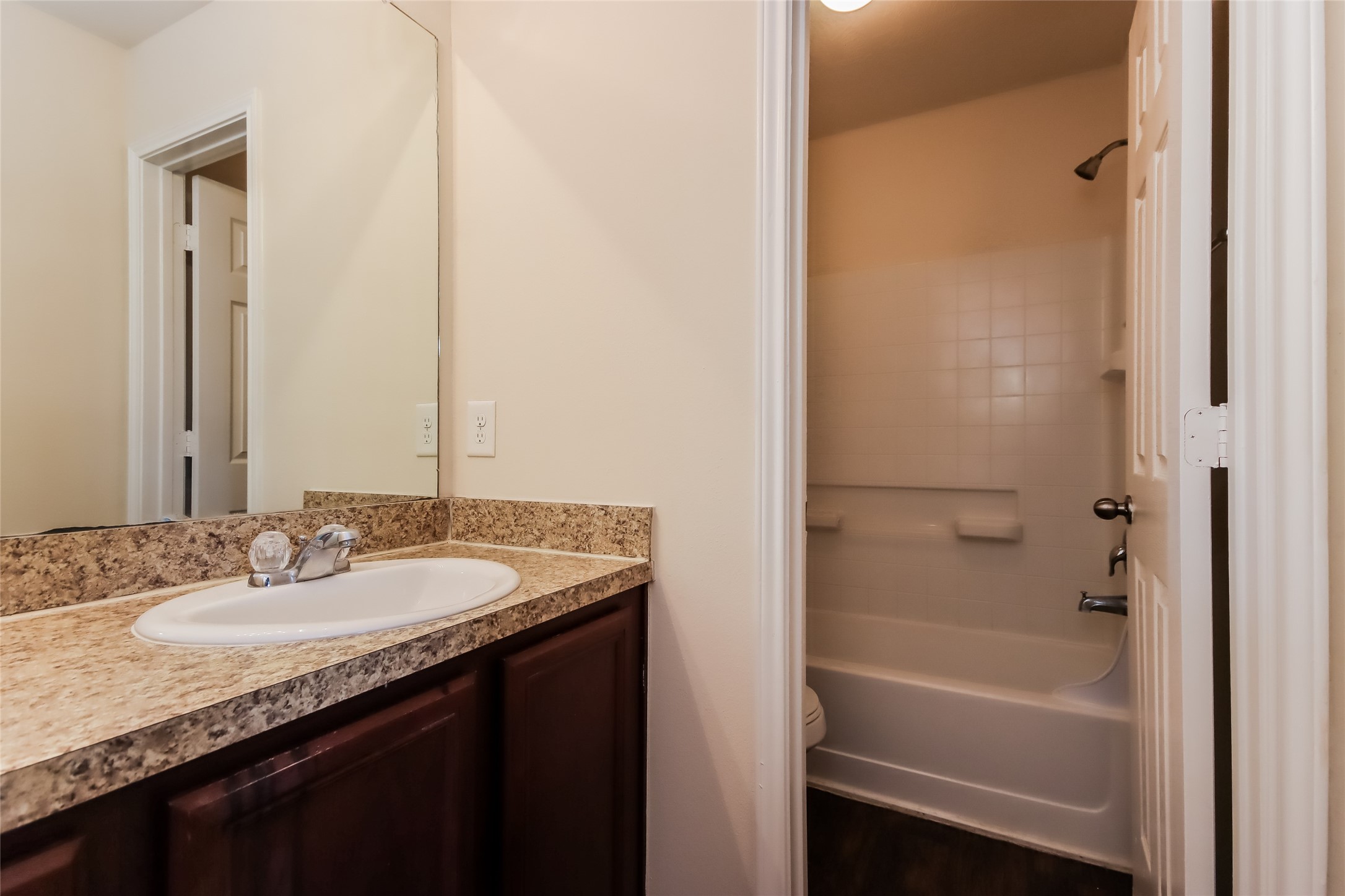 2411 High Island Way Houston, TX 77073 - Photo 13 of 13 a bathroom with a granite countertop sink and a mirror