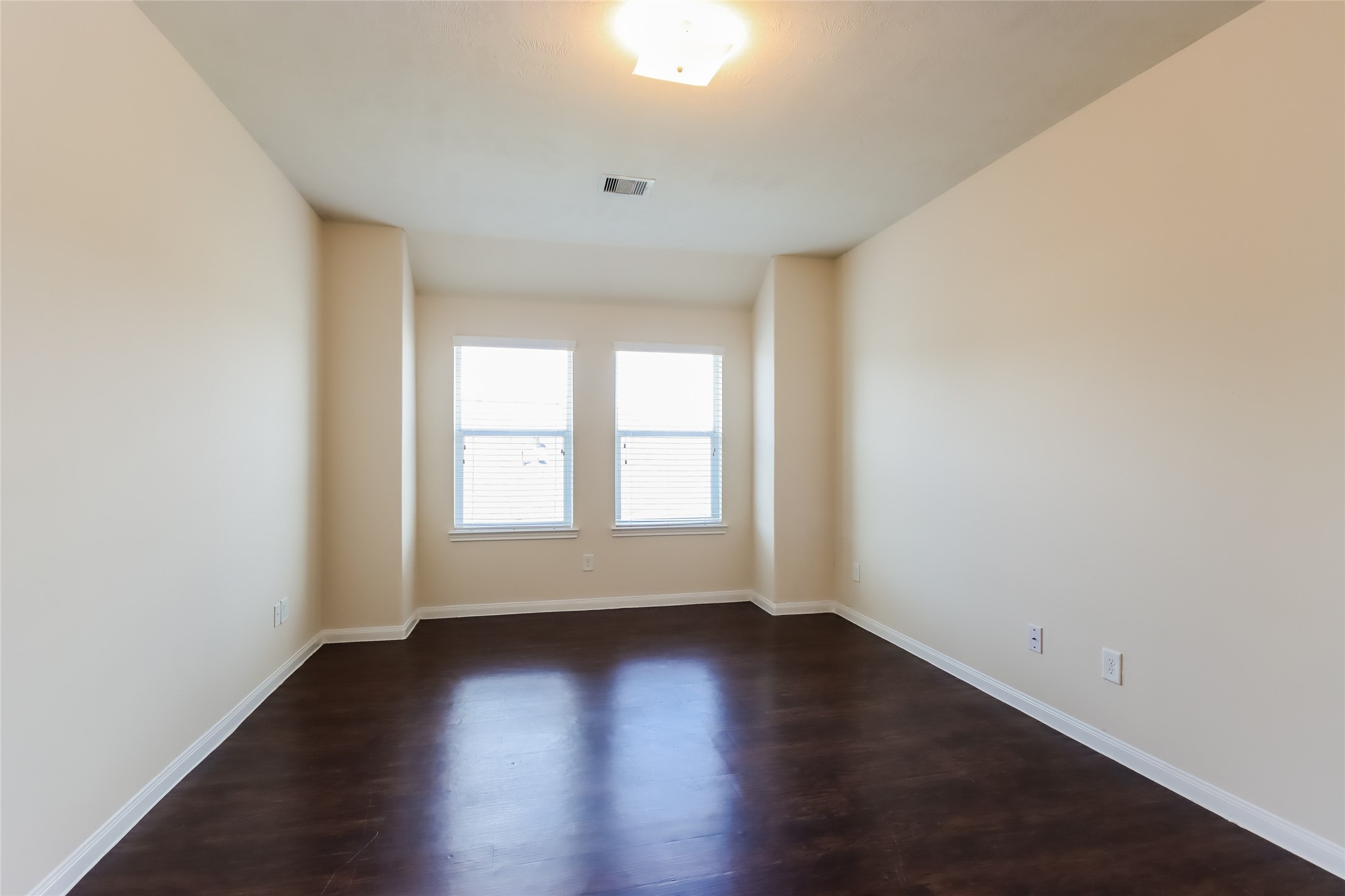 2411 High Island Way Houston, TX 77073 - Photo 6 of 13 an empty room with wooden floor and window