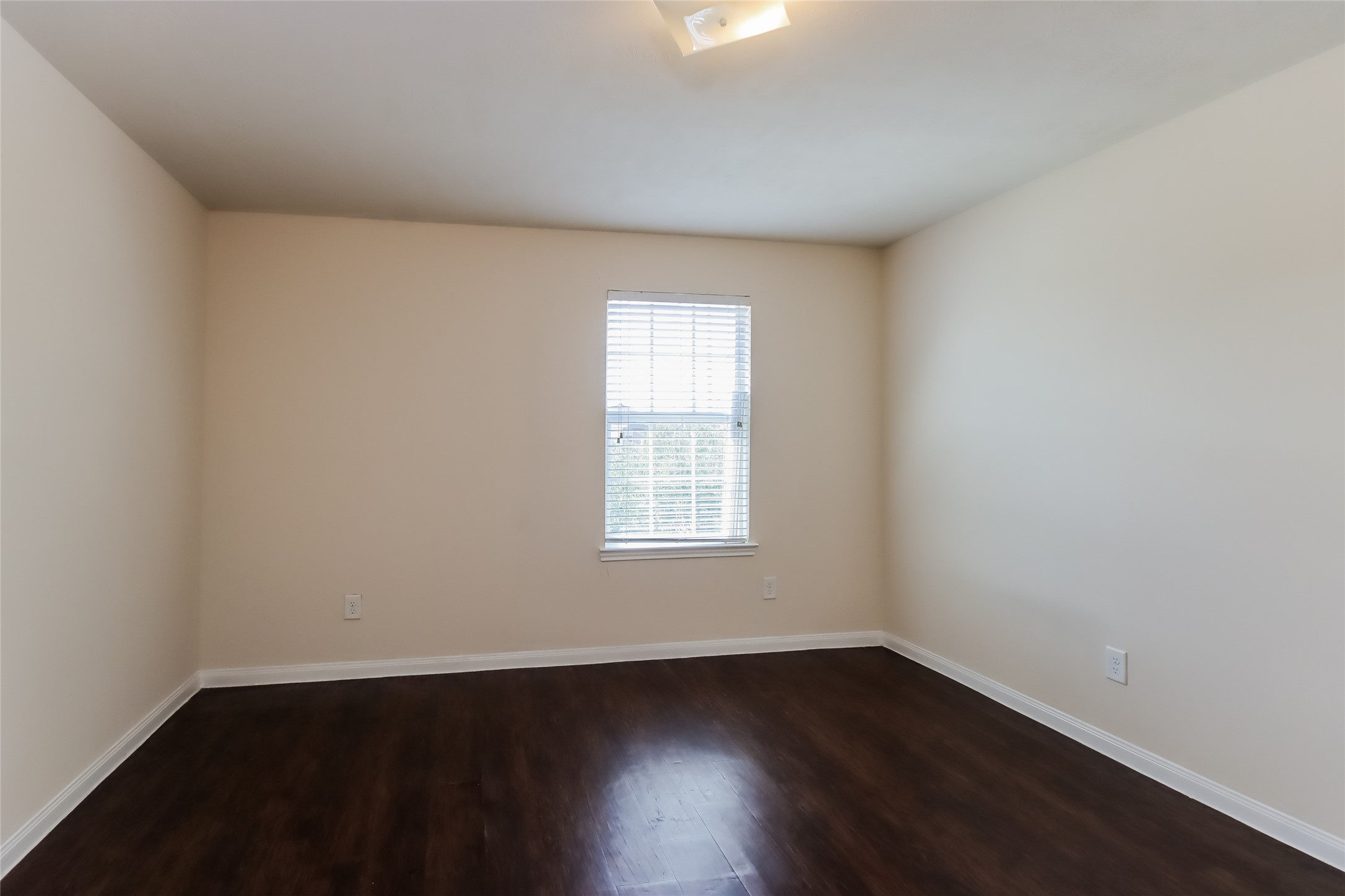 2411 High Island Way Houston, TX 77073 - Photo 10 of 13 an empty room with wooden floor and windows