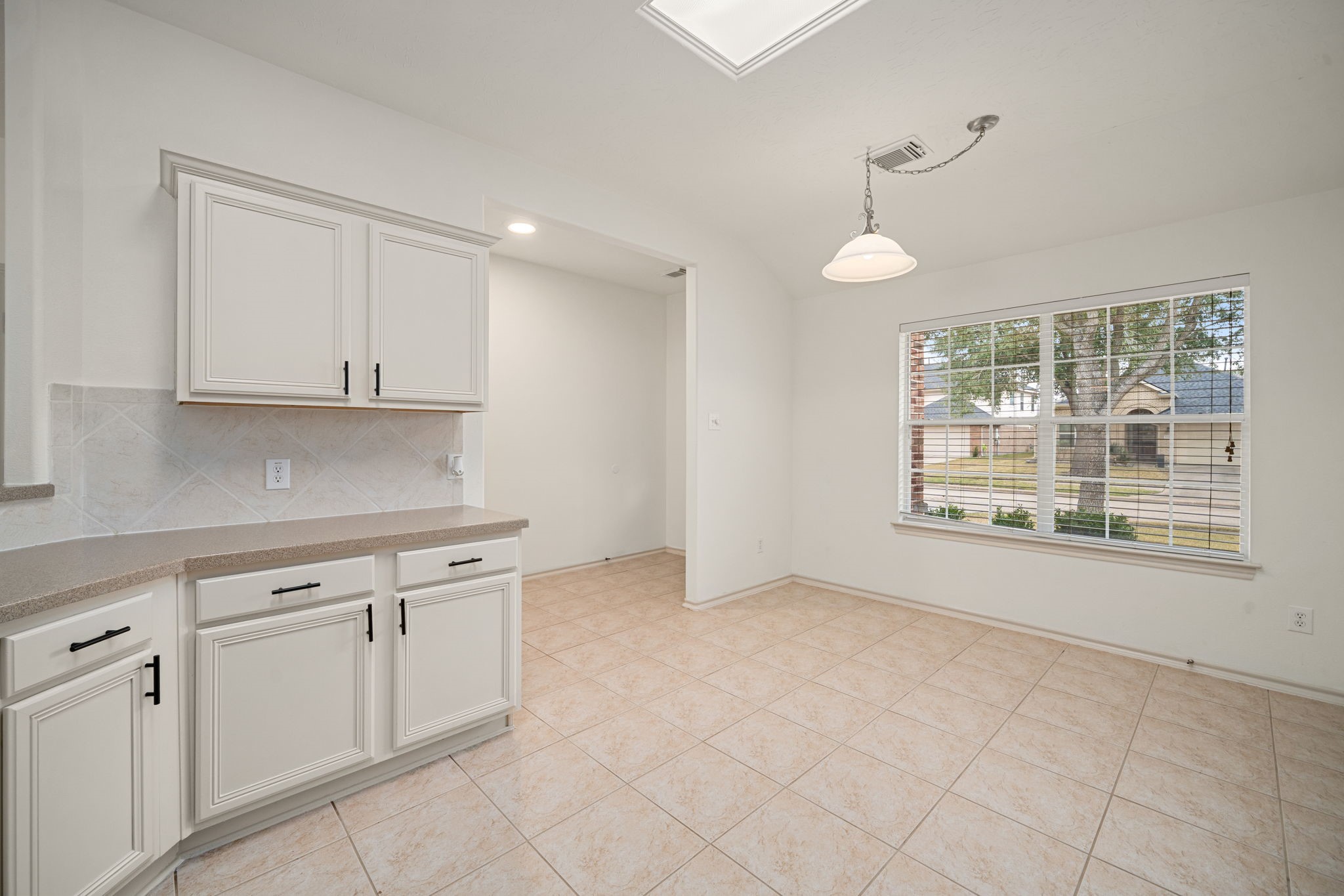 13410 Baron Hill Lane Rosharon, TX 77583 - Photo 12 of 40 a view of an empty room with a window