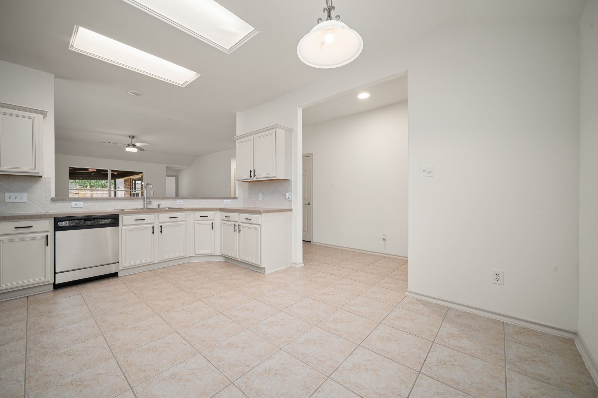 13410 Baron Hill Lane Rosharon, TX 77583 - Photo 15 of 40 a large white kitchen with a sink and cabinets