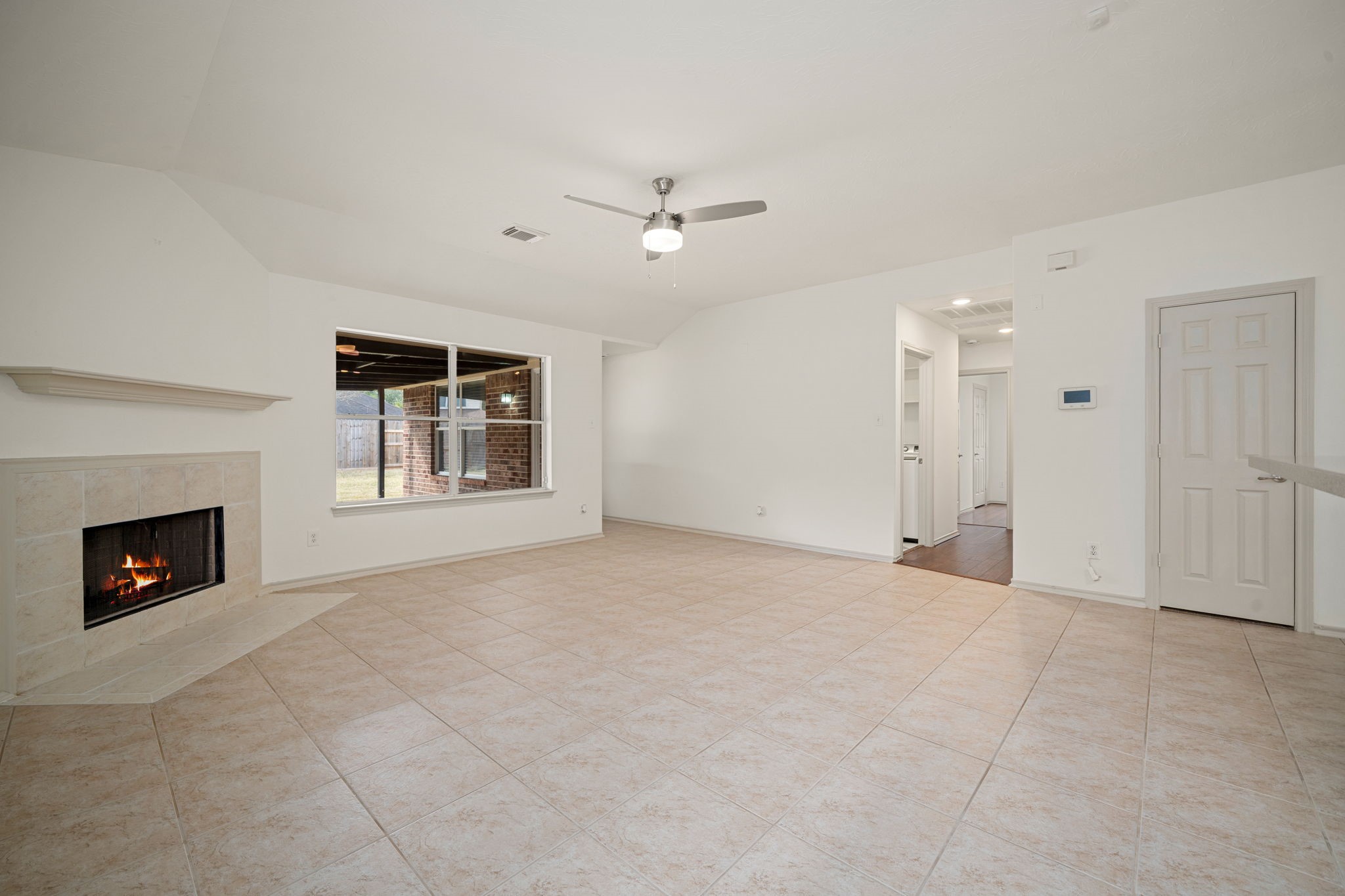 13410 Baron Hill Lane Rosharon, TX 77583 - Photo 18 of 40 an empty room with windows and fireplace