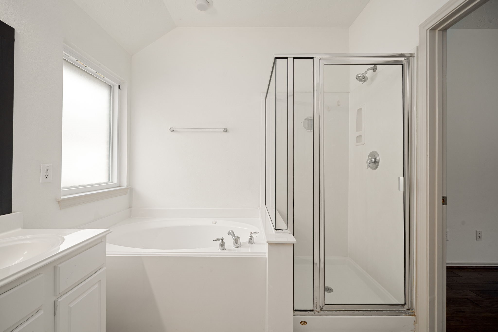 13410 Baron Hill Lane Rosharon, TX 77583 - Photo 23 of 40 a bathroom with a bathtub and a shower