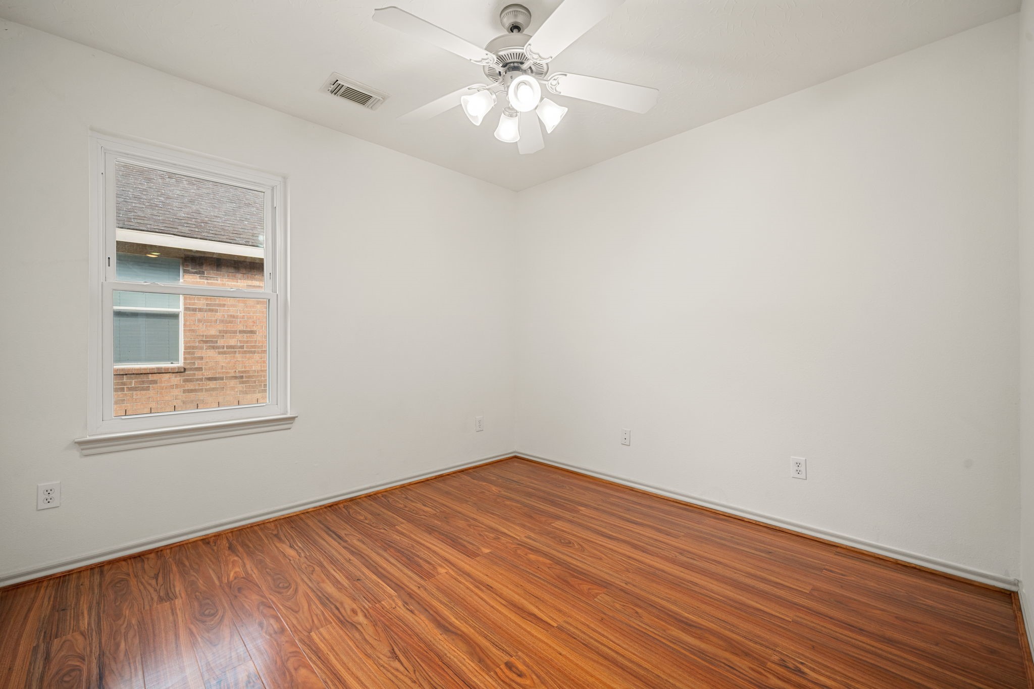 13410 Baron Hill Lane Rosharon, TX 77583 - Photo 25 of 40 an empty room with a window and a fan