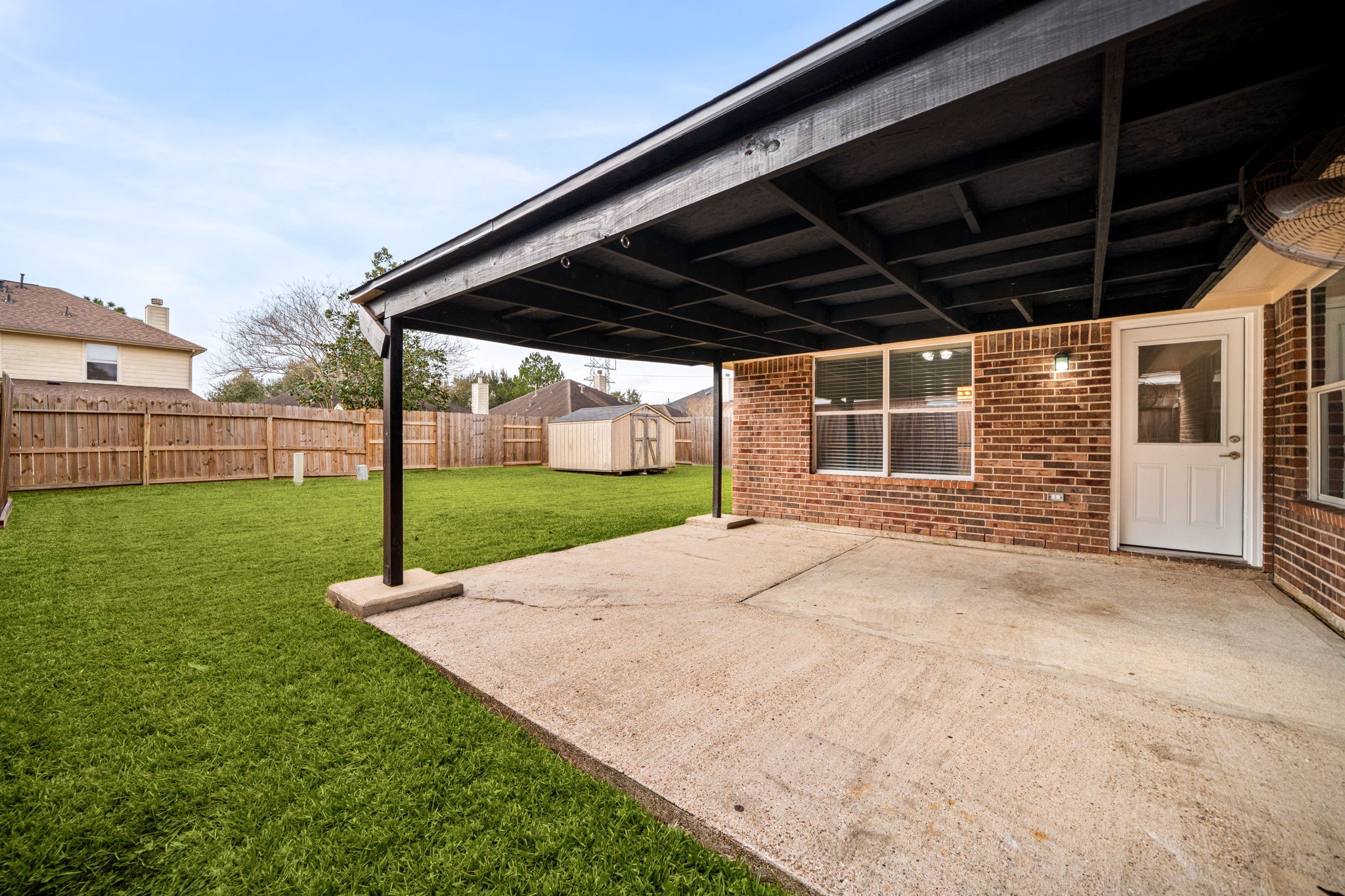 13410 Baron Hill Lane Rosharon, TX 77583 - Photo 33 of 40 a view of a backyard with a garden