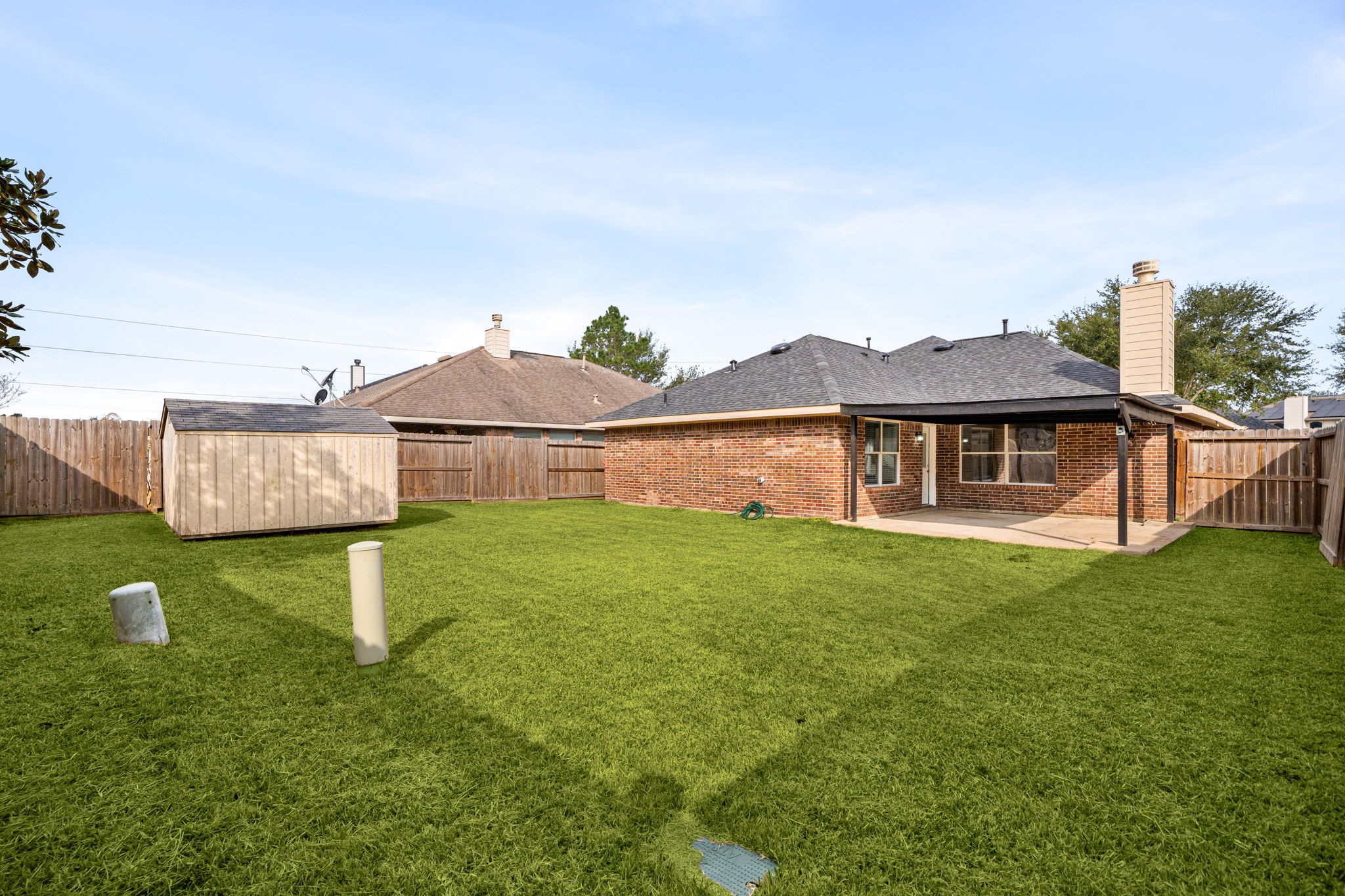 13410 Baron Hill Lane Rosharon, TX 77583 - Photo 35 of 40 a front view of a house with garden