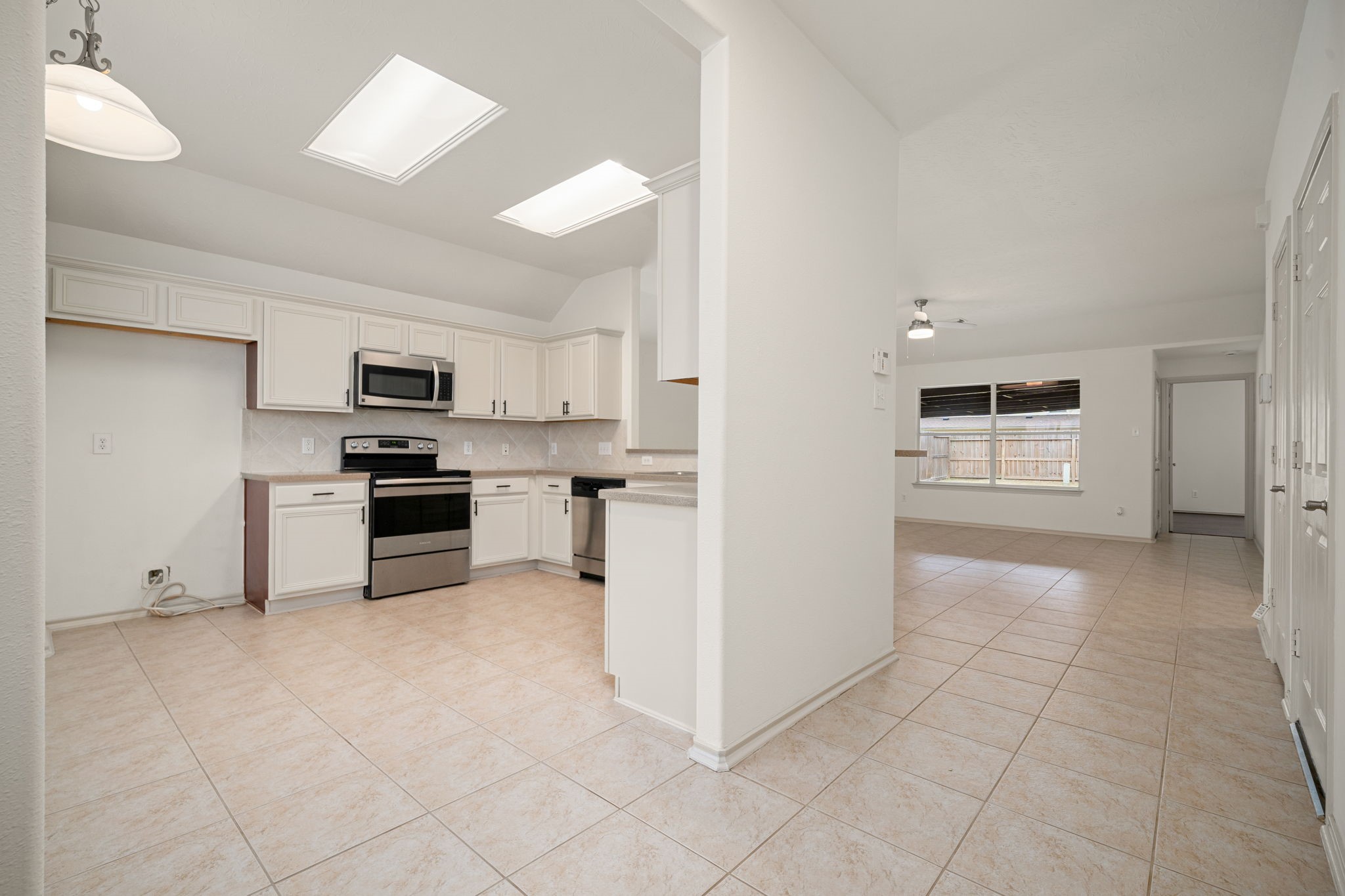 13410 Baron Hill Lane Rosharon, TX 77583 - Photo 8 of 40 a open kitchen with cabinets and stainless steel appliances