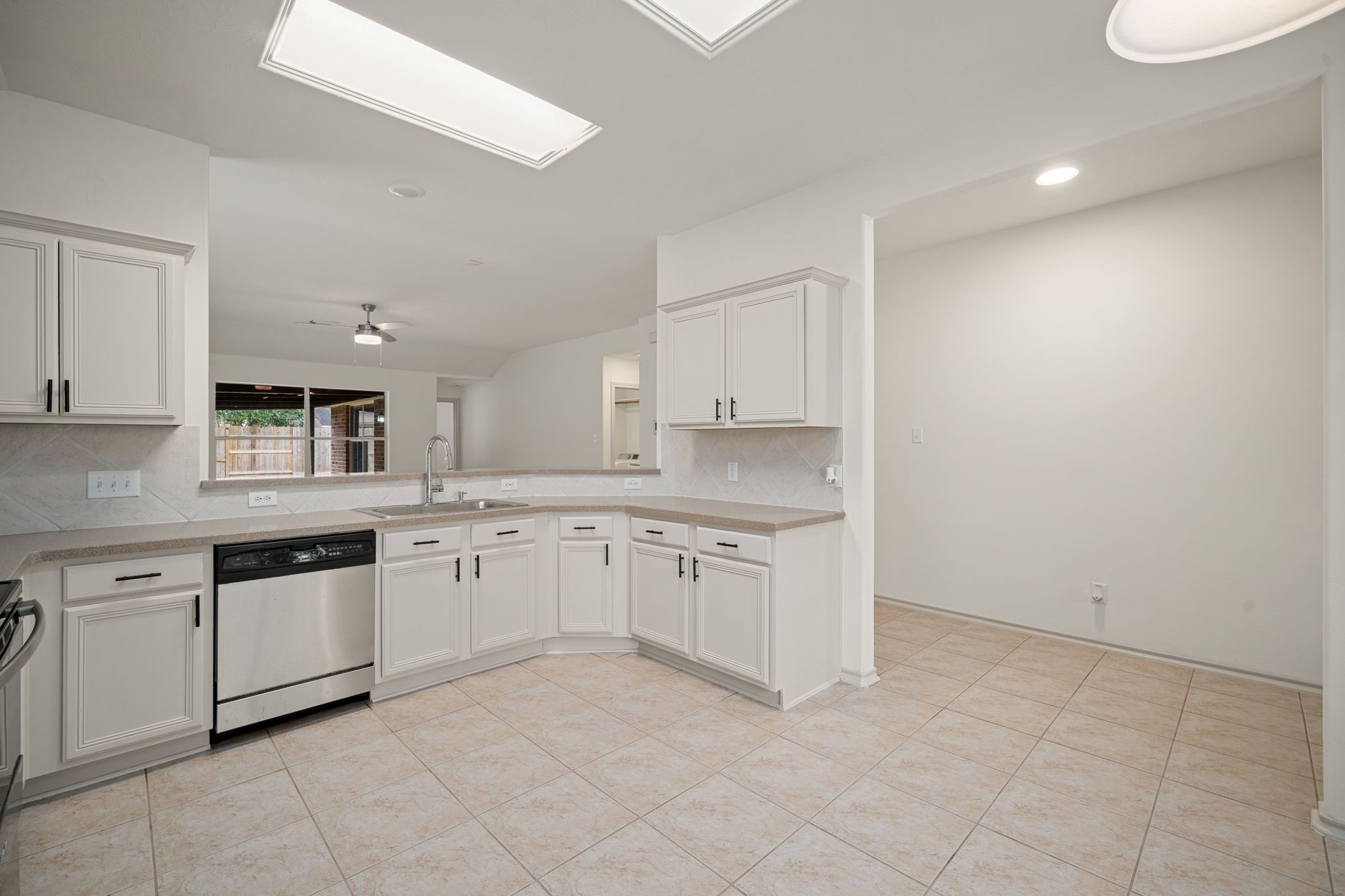 13410 Baron Hill Lane Rosharon, TX 77583 - Photo 10 of 40 a large kitchen with cabinets and sink