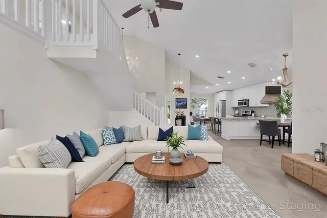 a kitchen with stainless steel appliances a refrigerator sink stove microwave and cabinets