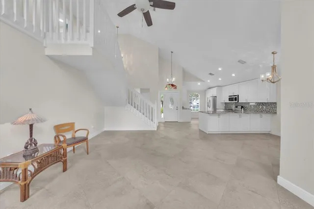 a kitchen with a refrigerator and a sink