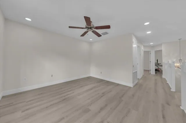 a spacious bedroom with a large bed and a couch