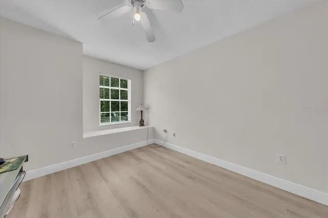 a balcony with table and chairs