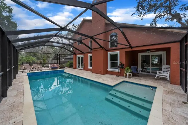 an aerial view of a house swimming pool and