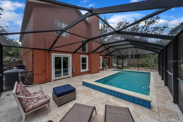 an aerial view of a houses with a lake view