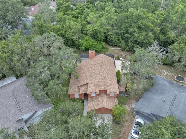 an aerial view of house with yard