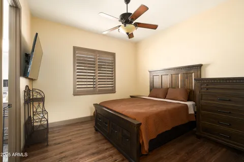 a bed sitting in a bedroom next to a window