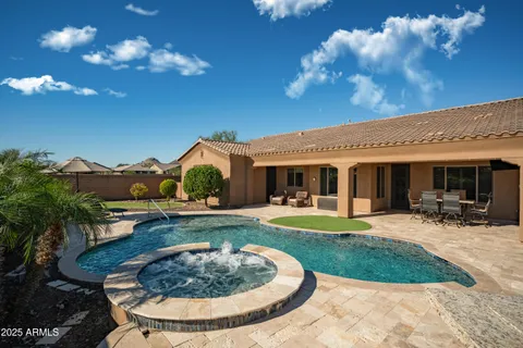 a view of a house with backyard outdoor seating and kitchen