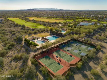 an aerial view of residential houses with outdoor space and river