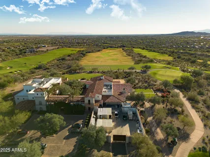 an aerial view of residential building and ocean