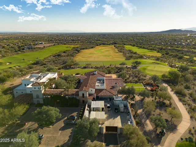 an aerial view of residential building and ocean