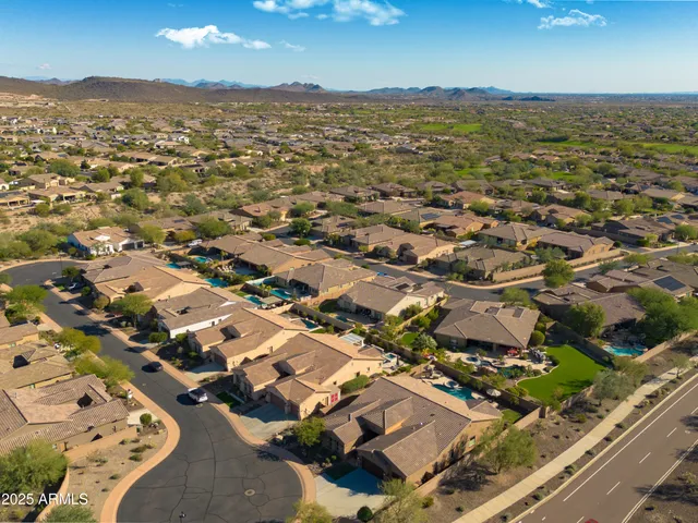 an aerial view of residential building with parking space
