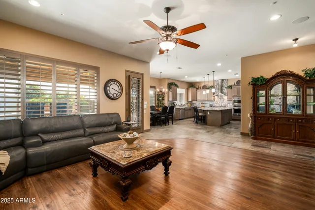 a living room with furniture and wooden floor