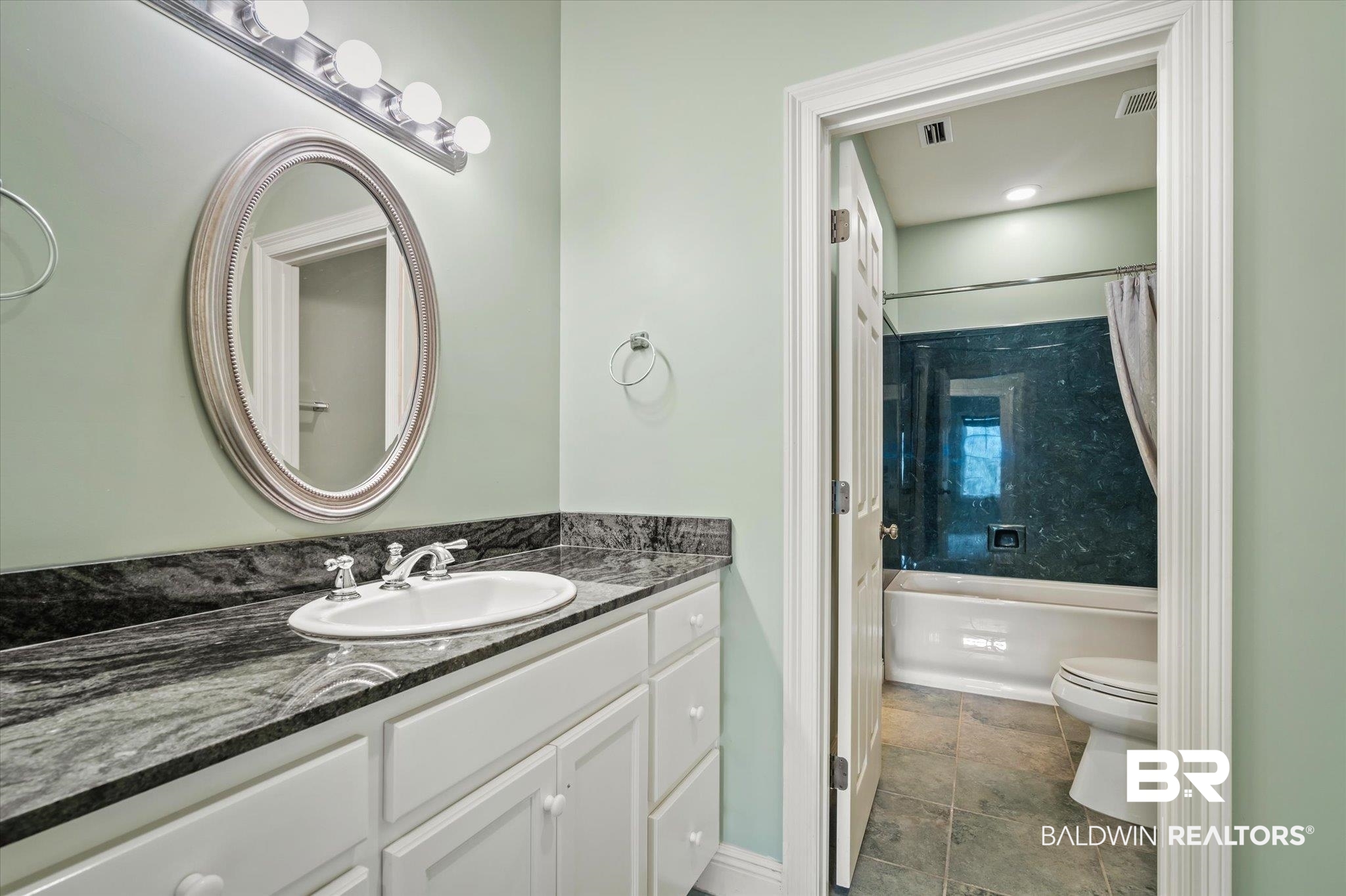 812 Country Club Court Mobile, AL 36609 - Photo 20 of 34 Full bathroom with vanity, toilet, and shower / bath combination with curtain