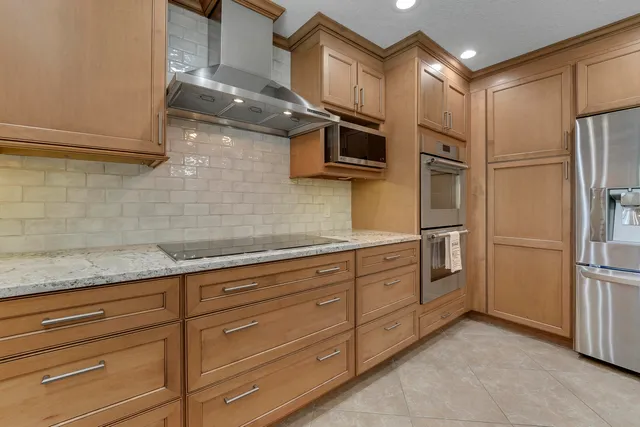 a kitchen with center island and a sink