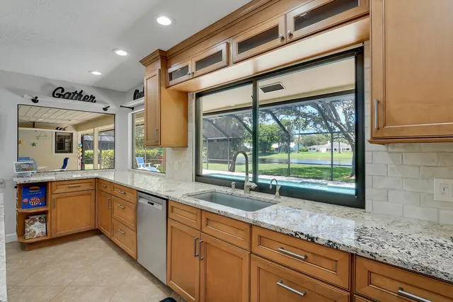 a bedroom with a large bed and a tv on dresser