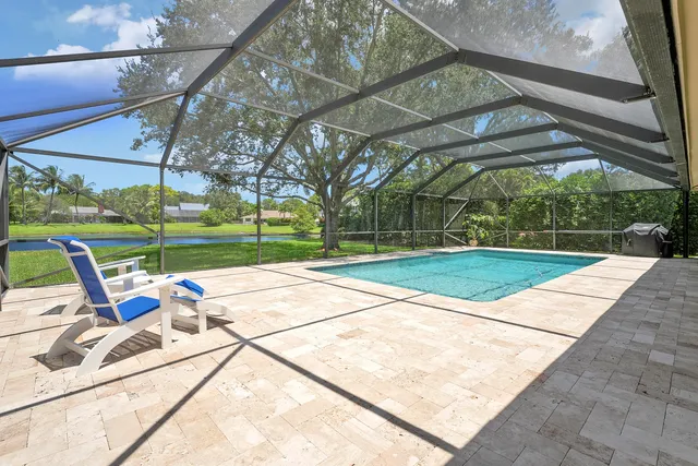 a view of a lake with houses in the back