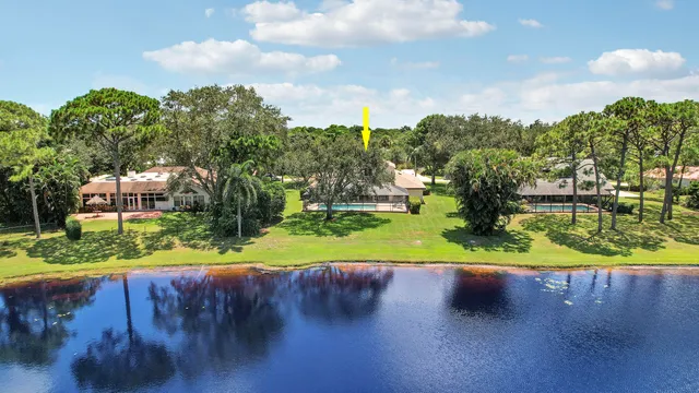 an aerial view of a pool patio outdoor seating and yard