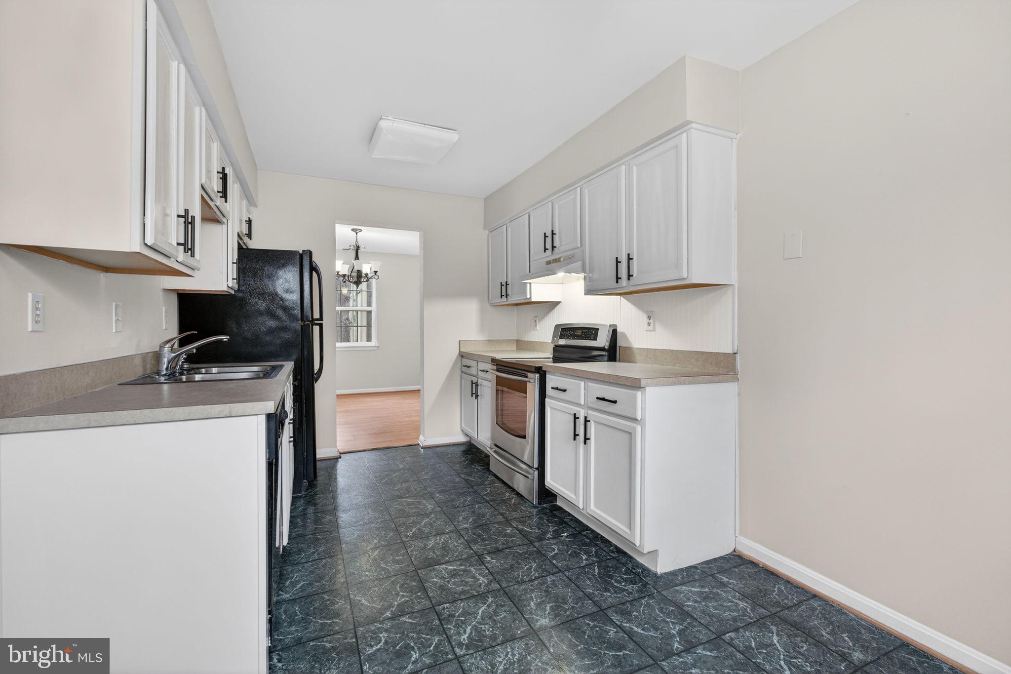 3362 Ryon Court Waldorf, MD 20601 - Photo 17 of 42 a kitchen with a sink a stove and refrigerator