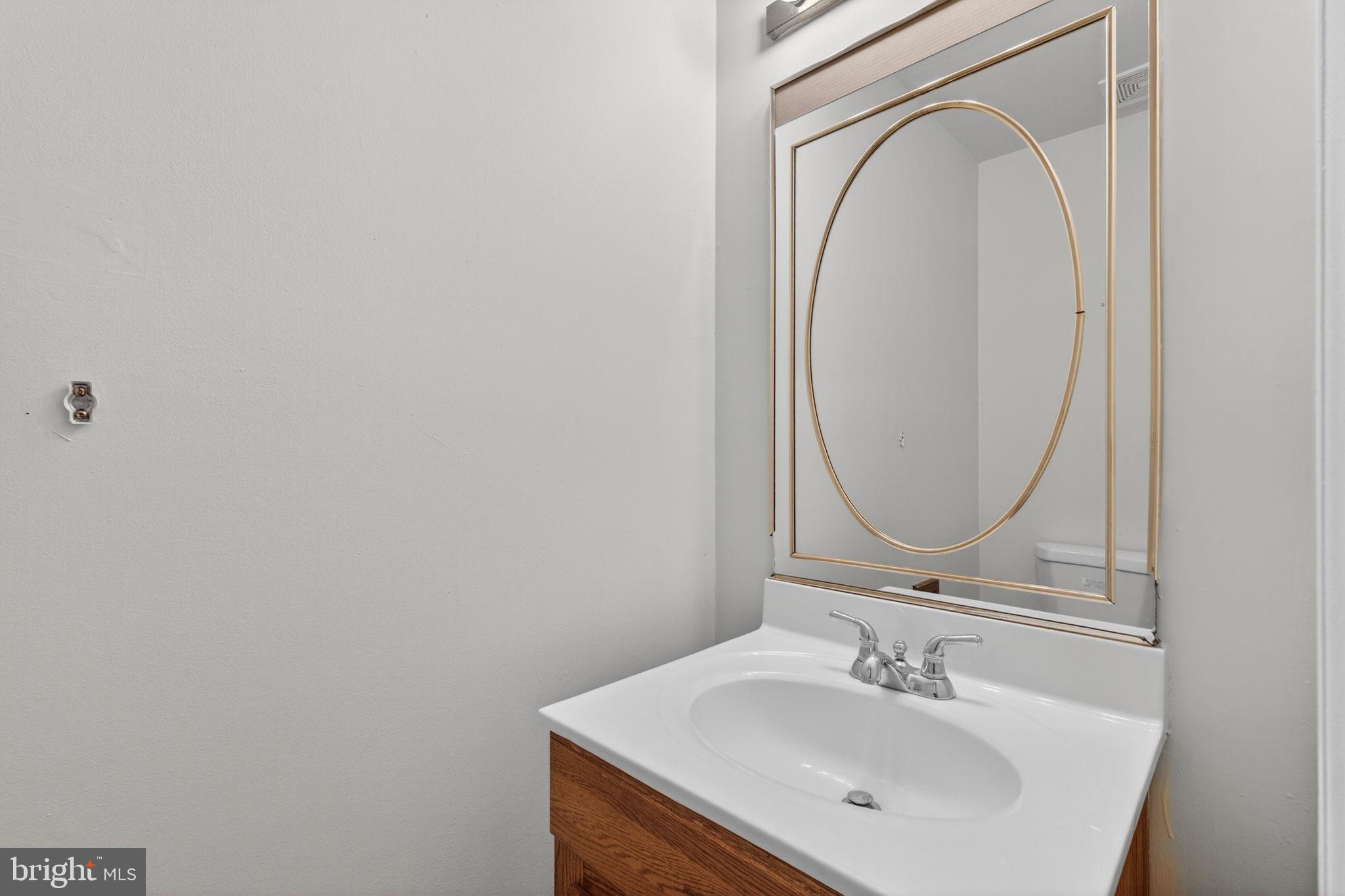 3362 Ryon Court Waldorf, MD 20601 - Photo 20 of 42 a bathroom with a sink and a mirror