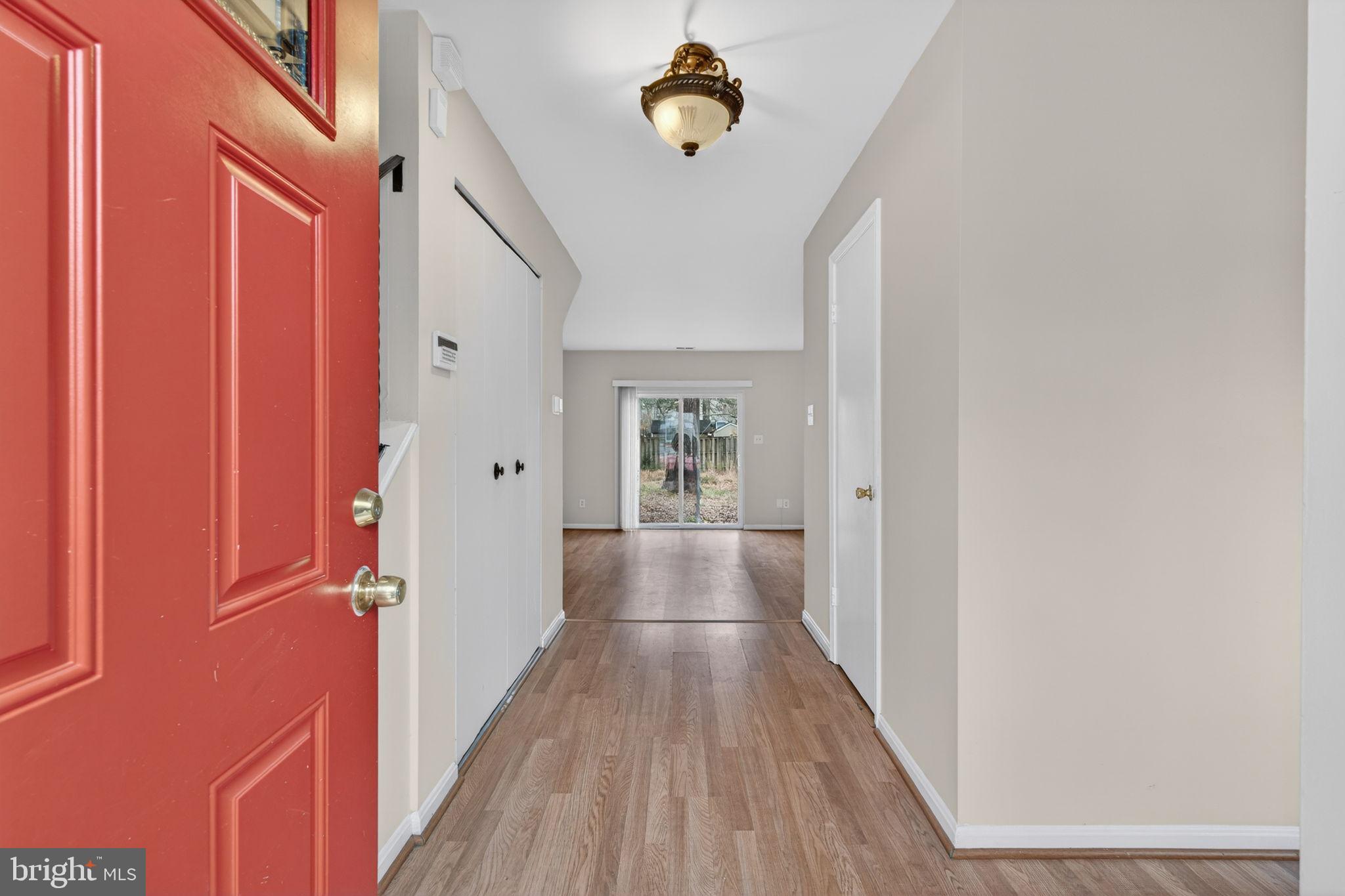 3362 Ryon Court Waldorf, MD 20601 - Photo 7 of 42 a view of a hallway with wooden floor and staircase