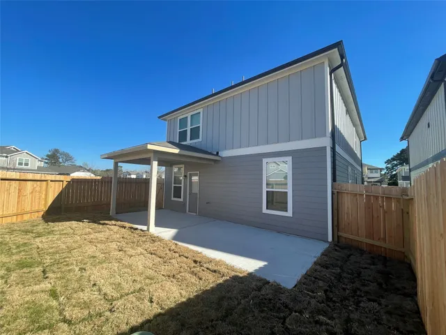 a house view with a backyard space
