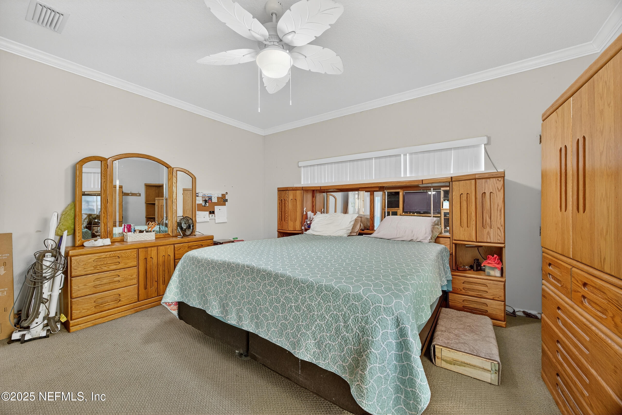 11319 Simmons Road Jacksonville, FL 32218 - Photo 15 of 32 a bedroom with a bed and a view of closet